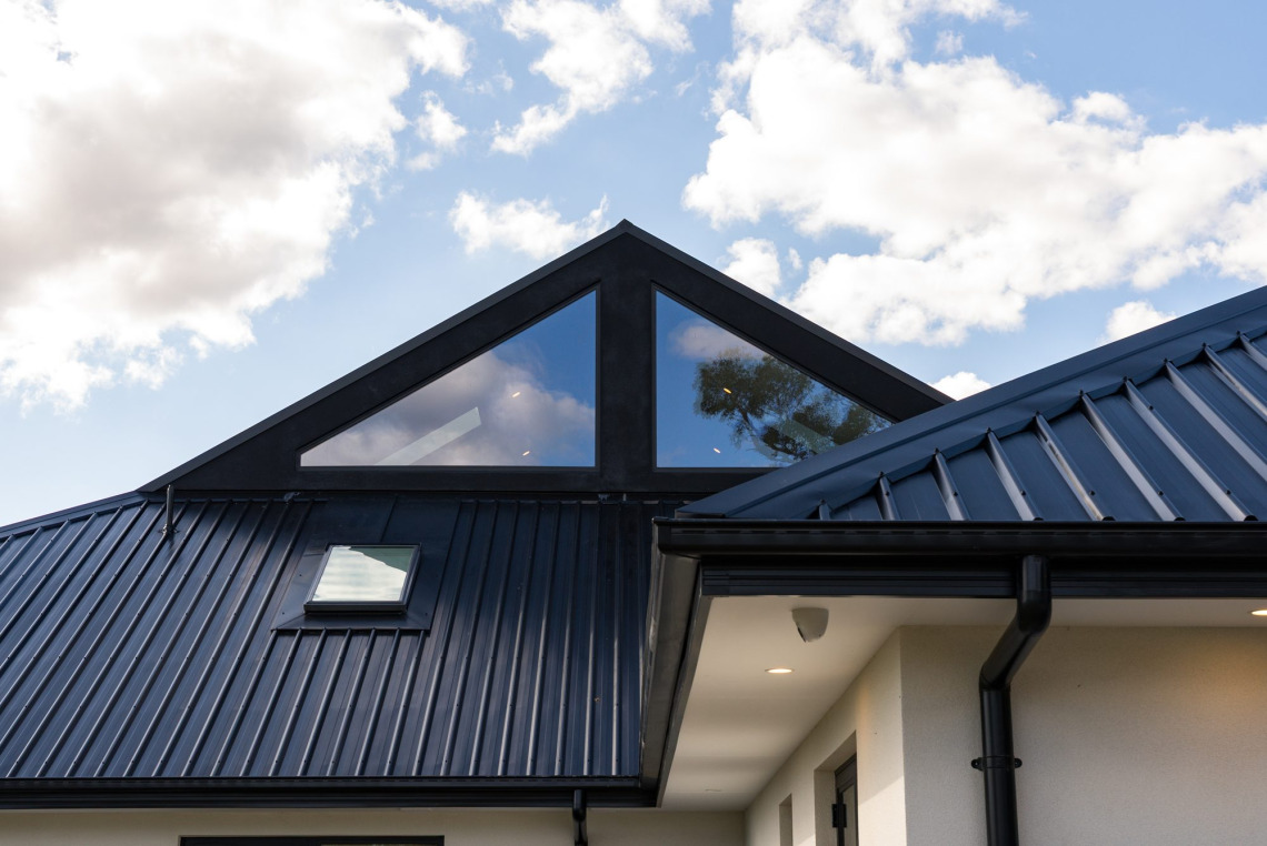 Triangular Signature raked windows set into the roof gable of a Mooroolbark home