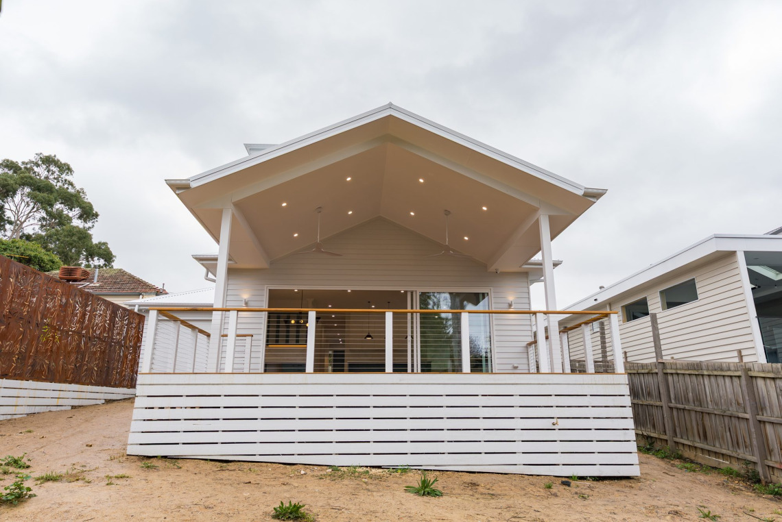 Rear alfresco deck of a Ringwood North home opening to the living area through an aluminium stacking door
