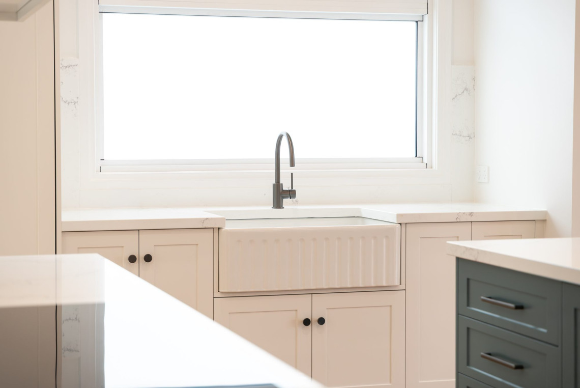 White aluminium awning window above a farmhouse sink, Ringwood North